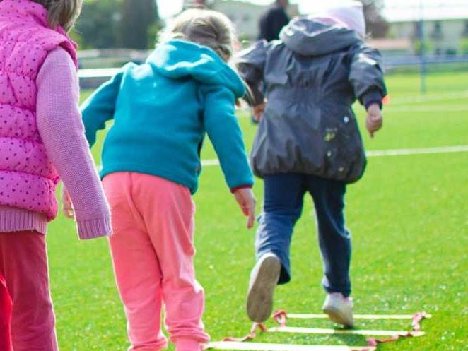 Group of children doing ladder exercises